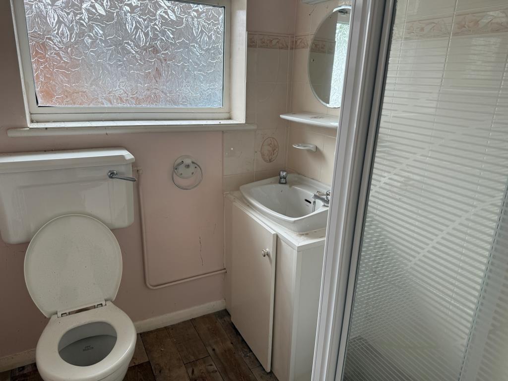 Lot: 159 - BUNGALOW WITH GARAGE AND GARDENS IN NEED OF MODERNISATION - Shower room with white suite and window to rear